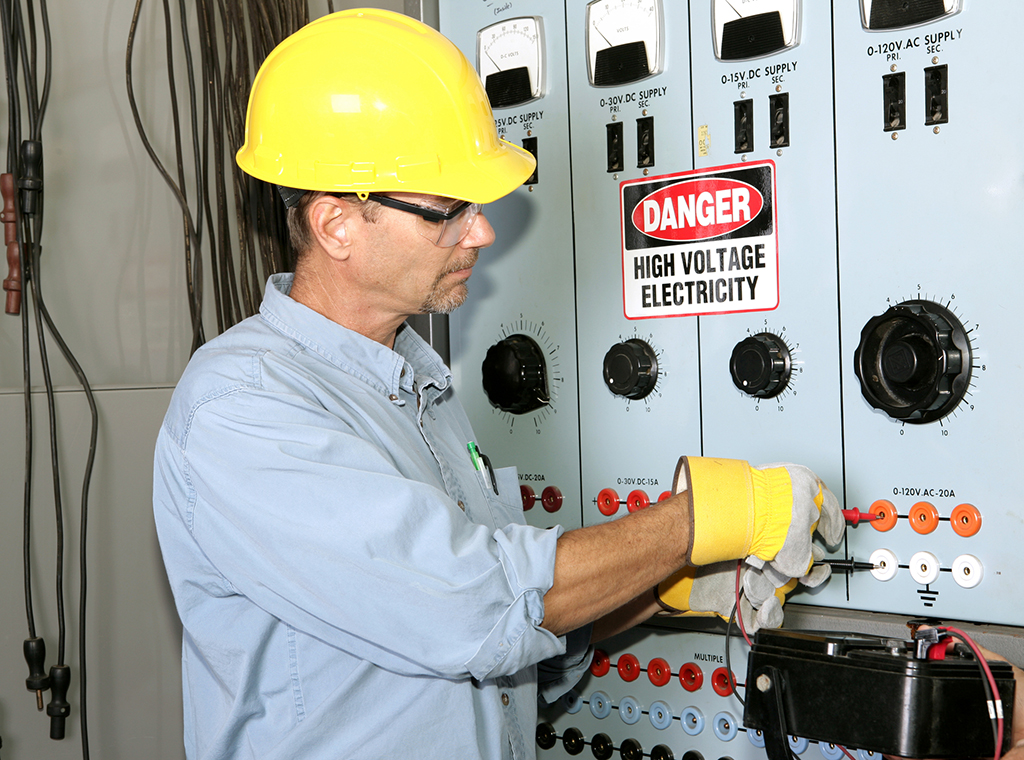 Electrician Working On An Industrial Power Plant